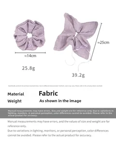 Size chart for purple tweed scrunchies showing measurements 14cm and 25cm on white backdrop