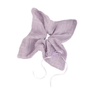 Detail of lavender tweed scrunchie with elegant ribbon bow and decorative button accessory