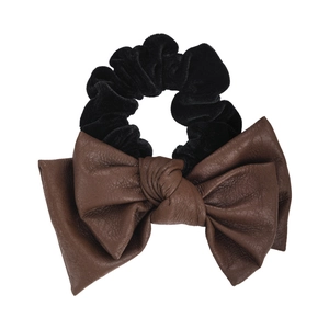 Brown leather bow hair scrunchie with black velvet band on a clean white background