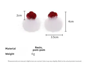 Detailed view of red resin rose earrings with soft white faux fur balls and measurements