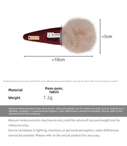 Détail de la pince à cheveux en peluche avec dimensions de 10 cm de long et 5 cm pour la boule