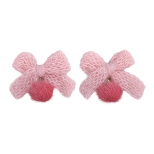 Pink knitted bow earrings with dark red faux fur pom poms on a clean white background