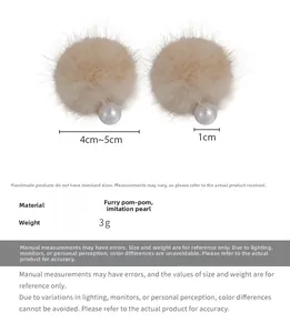 Detailed view of beige plush ball earrings with pearls, size 4-5cm and 3g weight specifications