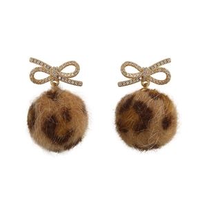 Winter bow earrings featuring leopard print plush balls and gold crystal studs