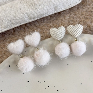 Winter heart-shaped fuzzy drop earrings with plush faux fur balls and ribbed texture