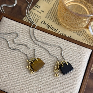 Vintage mini handbag pendant necklace with tiger eye stone and obsidian beaded details