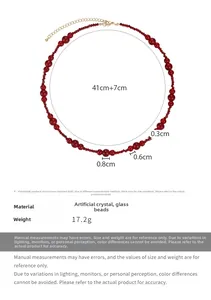 Detailed view of vintage burgundy beaded necklace with gold clasp and 7cm extension chain