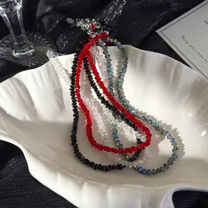 Luxurious triangular faceted crystal beaded necklace in black, red, and blue tones