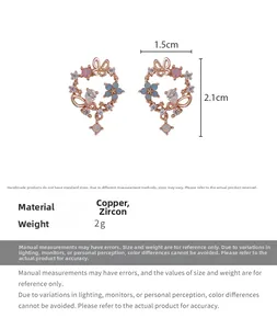 Macro view of rose gold floral stud earrings with blue zircon butterflies and petals