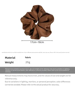 Detail showing oversized brown satin scrunchie with 17-18cm diameter and 29g weight