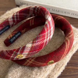 Classic red plaid headband set with handmade metal plaque on cozy fleece surface