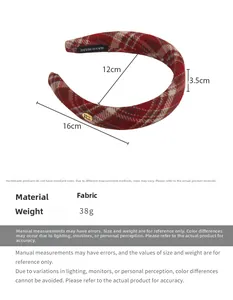 Detail view of red plaid headband showing thickness and dimensions for women