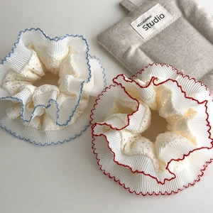 Vintage lace scrunchie with blue and red wave edges and pleated embroidery detail
