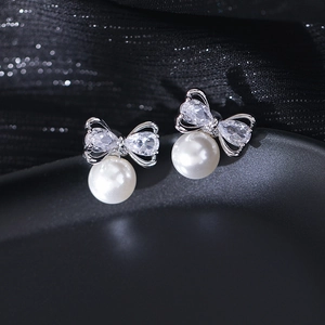 Bowknot pearl stud earrings with zircon inlay and silver finish for elegant women style