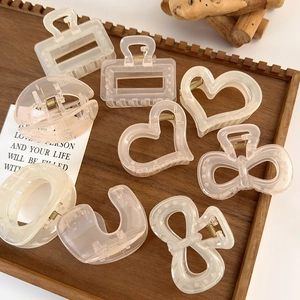 Translucent camellia bow hair claw clips set in elegant beige and pink tones