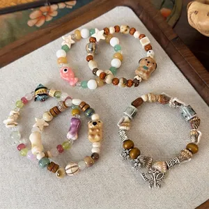 Set di braccialetti con perline di ceramica a forma di cane e pesce fatti a mano