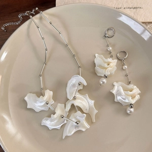 Elegant shell jewelry set with silver necklace and pearl drop earrings for women
