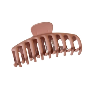 Matte pink large shark hair claw clip for women in 45-degree angle view on white background