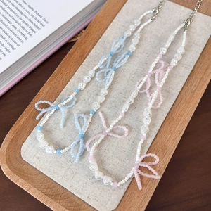 Beaded bow necklace with pink and blue heart pearls and crystal accents for women