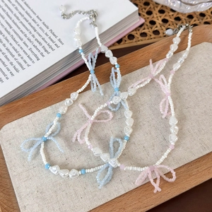 Handmade beaded choker with crystal bow pendants and heart pearls in pink and blue
