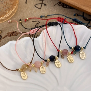 Handmade woven fortune bracelets set with gold lucky charms and beads for women