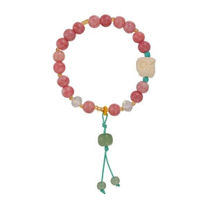 Traditional Chinese pink beaded bracelet with lion motif bead and green tassel decoration