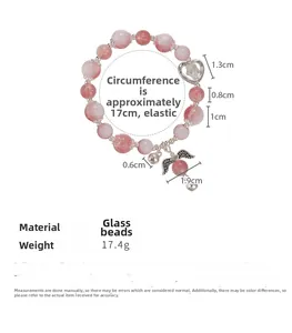 Detail view of pink beaded bracelet with angel wing charms and 17cm stretch circumference