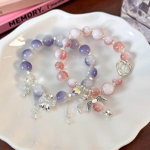 Floral butterfly angel beaded bracelets in purple and pink with heart and bell charms