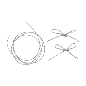 Y2K silver hair styling kit with thin metallic bow clips and flexible braiding cord