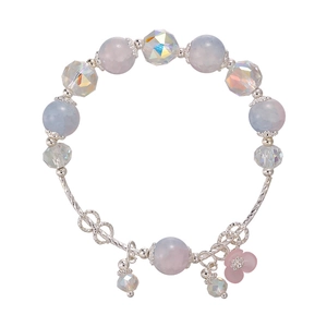 Beaded bracelet with fishtail shell charm and pink flower pendant in silver finish