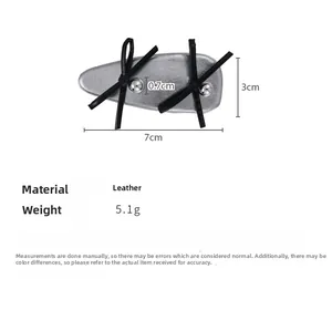 Detail view of silver leather ballet style hair clip with black bow and size dimensions