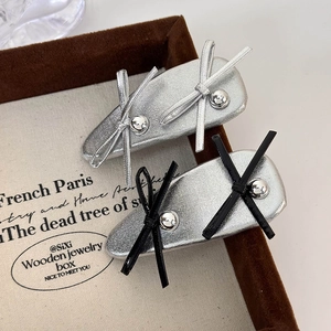 Silver balletcore style leather bow hair clips with metallic bead accents in a gift box