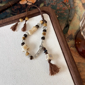 Bracciale vintage di perline a stella con pietra occhio di tigre e nappe in stile etnico