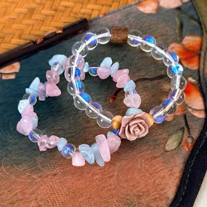 Ethnic style beaded bracelets with pink roses, colorful stones, and wood beads