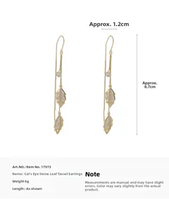 Detailed view of leaf tassel earrings with cat eye stones and dimensions 8.7cm long
