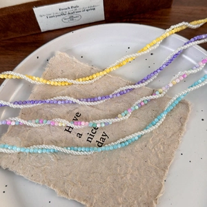Colorful beaded pearl necklaces with twisted rope design in vibrant summer styles