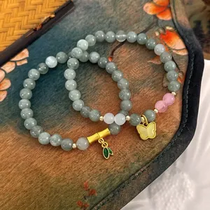 Bracelet de Perles en Pierre Naturelle de Nouveau Style Chinois Perles Gris Vert Avec Breloques Papillon et Bambou Dorées