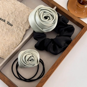 Mint green rose floral hair tie set with satin flower design on wooden tray