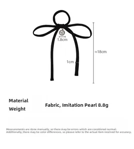Detail showing bow hair tie dimensions with a 1.8cm pearl pendant and 18cm long ribbon