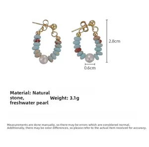 Detail of beaded hoop earrings with freshwater pearl and natural shoushan stones