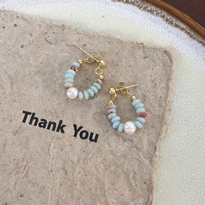 Handmade stone bead earrings with freshwater pearl accents and golden rings