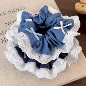 Blue denim hair scrunchie with white lace trim and small pastel bows for women