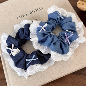 Denim hair scrunchies with white lace edges and small colorful ribbon bows set