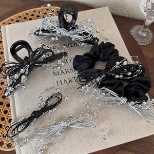 Chic black and silver hair accessory set featuring metallic bead bow claw clips and scrunchies