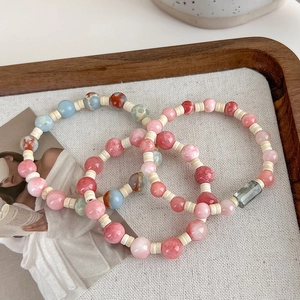 Pink and blue handmade stone beaded bracelets set for women in elegant wooden tray