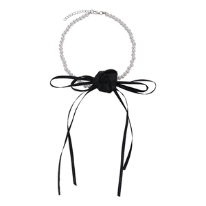 Elegant French style pearl choker necklace with large black ribbon bow and camellia flower