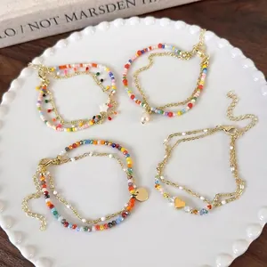 Double-layered colorful beaded bracelet set with gold heart and pearl charms
