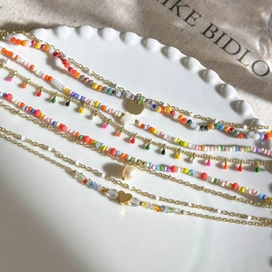 Colorful double-layer beaded bracelet with gold chain and heart star pendants