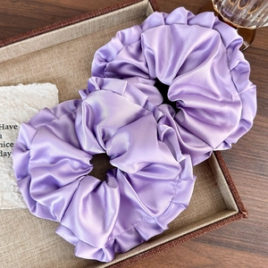 Set of two purple satin ruffled scrunchies with elegant silk texture for women hair