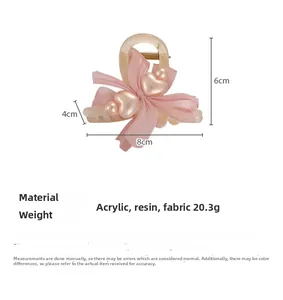 Detailed size view of the 8cm pink bow hair claw clip with heart and pearl accents